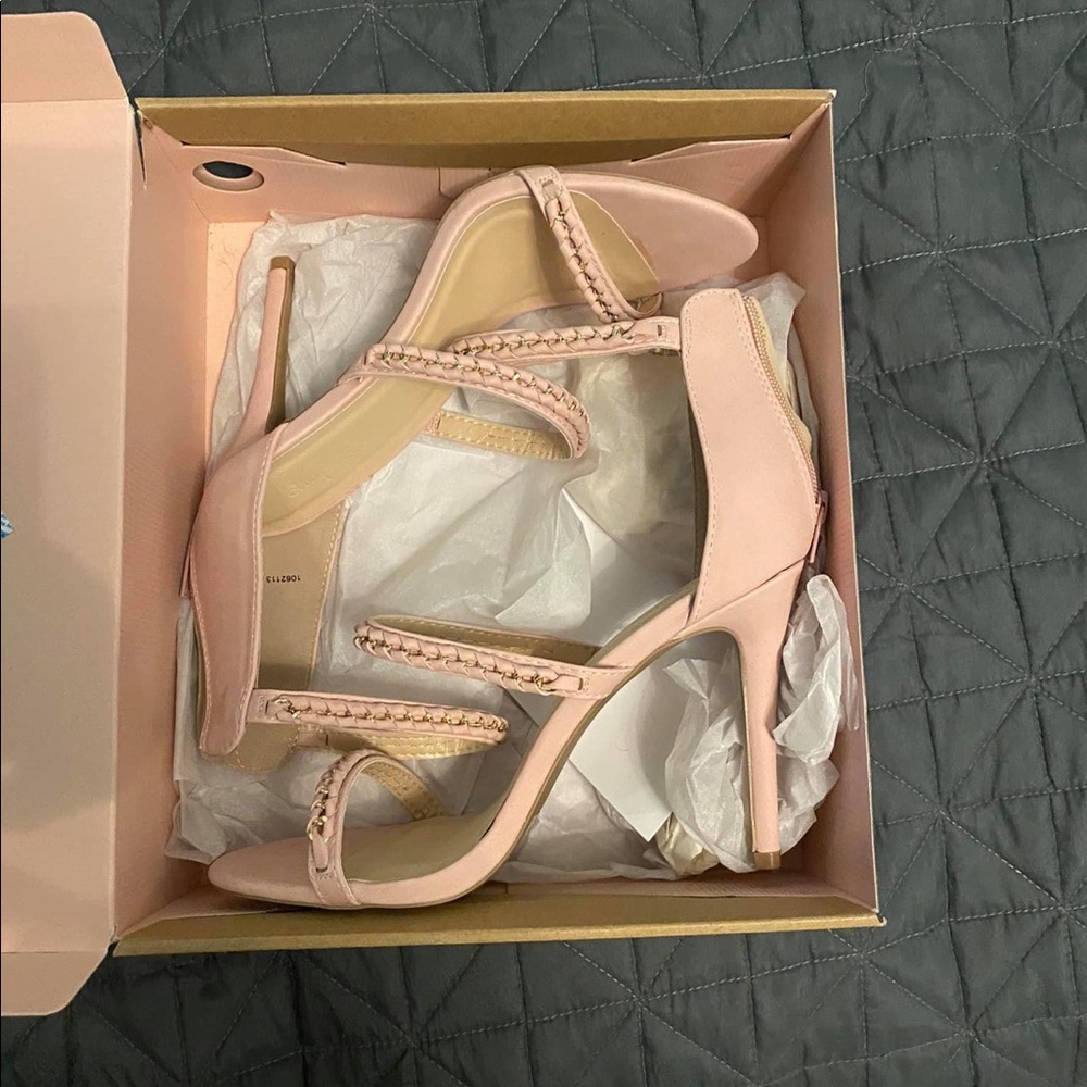 Pastel pink heels with gold chain across straps